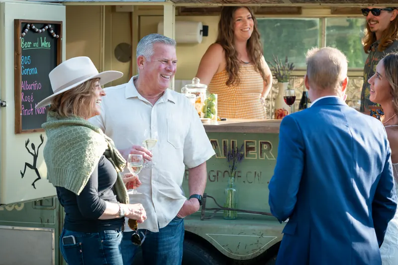 Guests chatting at the bar
