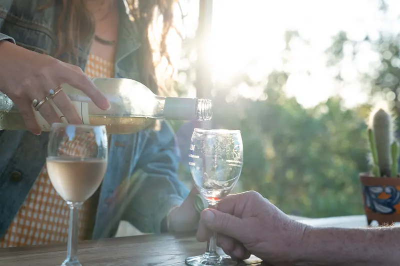 White wine being poured in the late afternoon sun